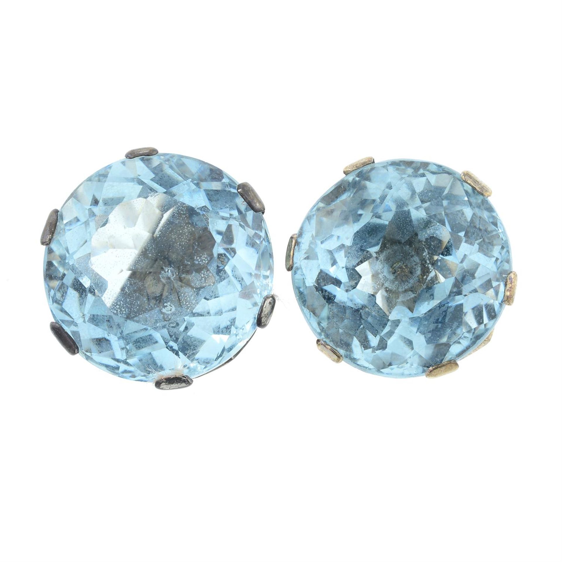 A pair of aquamarine stud earrings, and an emerald and diamond pendant.