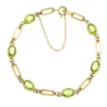 A 9ct gold peridot bracelet.