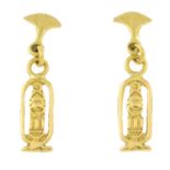 A pair of Egyptian cartouche drop earrings, each suspended from a lotus surmount.