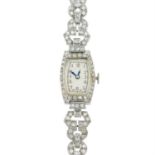 A lady's early 20th century platinum diamond cocktail watch.