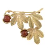 A mid 20th century 9ct gold chalcedony brooch, depicting a chestnut branch.