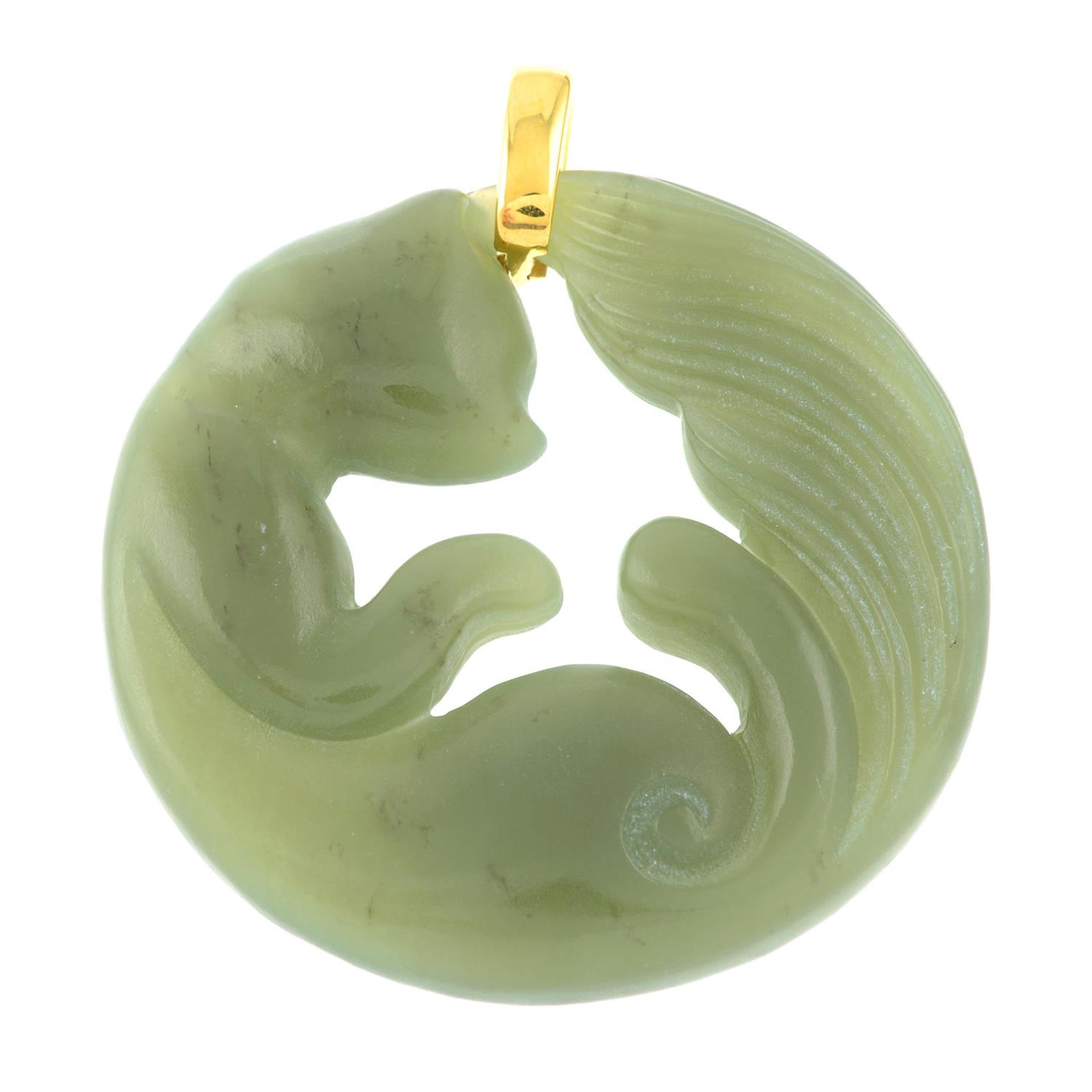 A carved nephrite jade cat pendant.