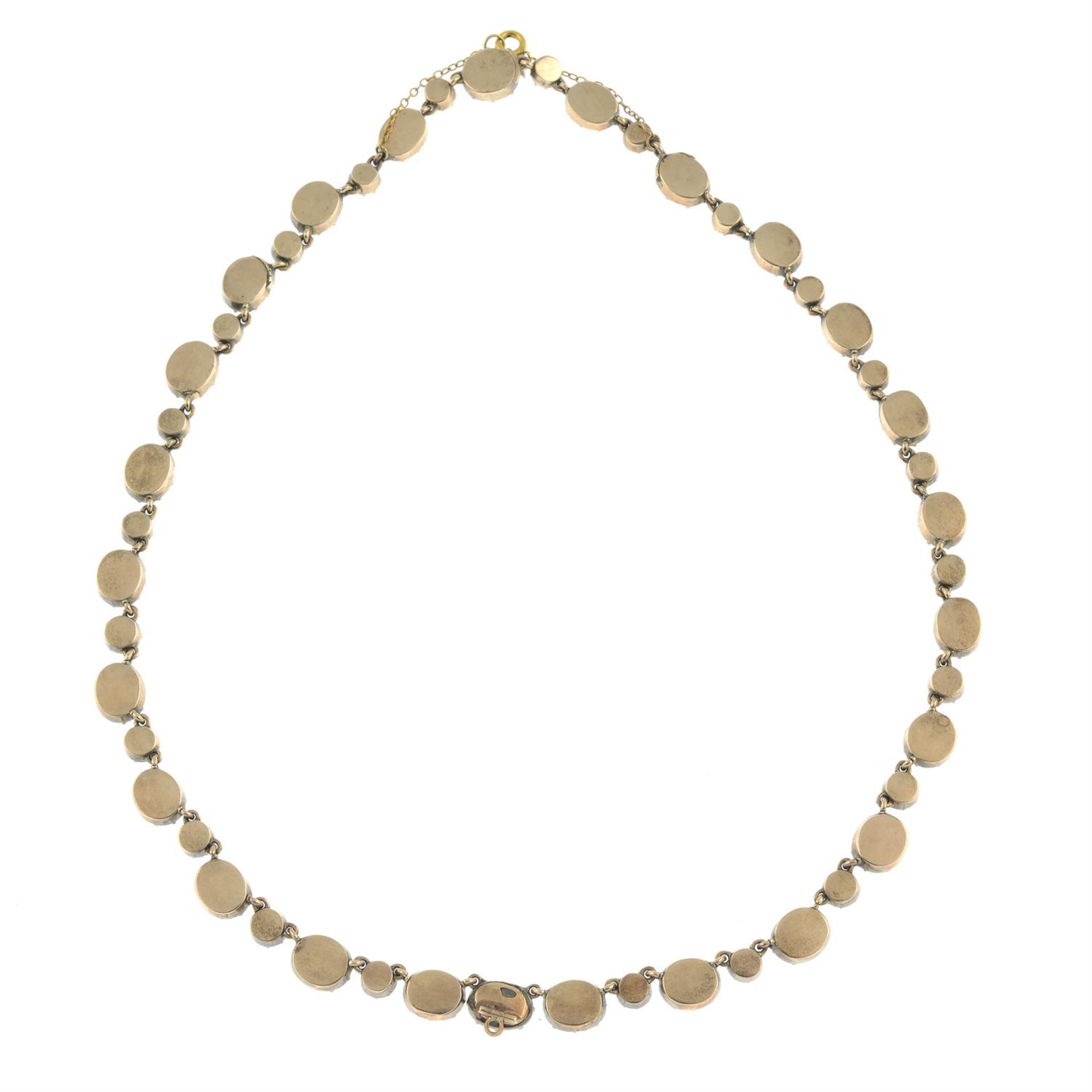 A late Georgian gold foil back garnet rivière necklace. - Image 4 of 5