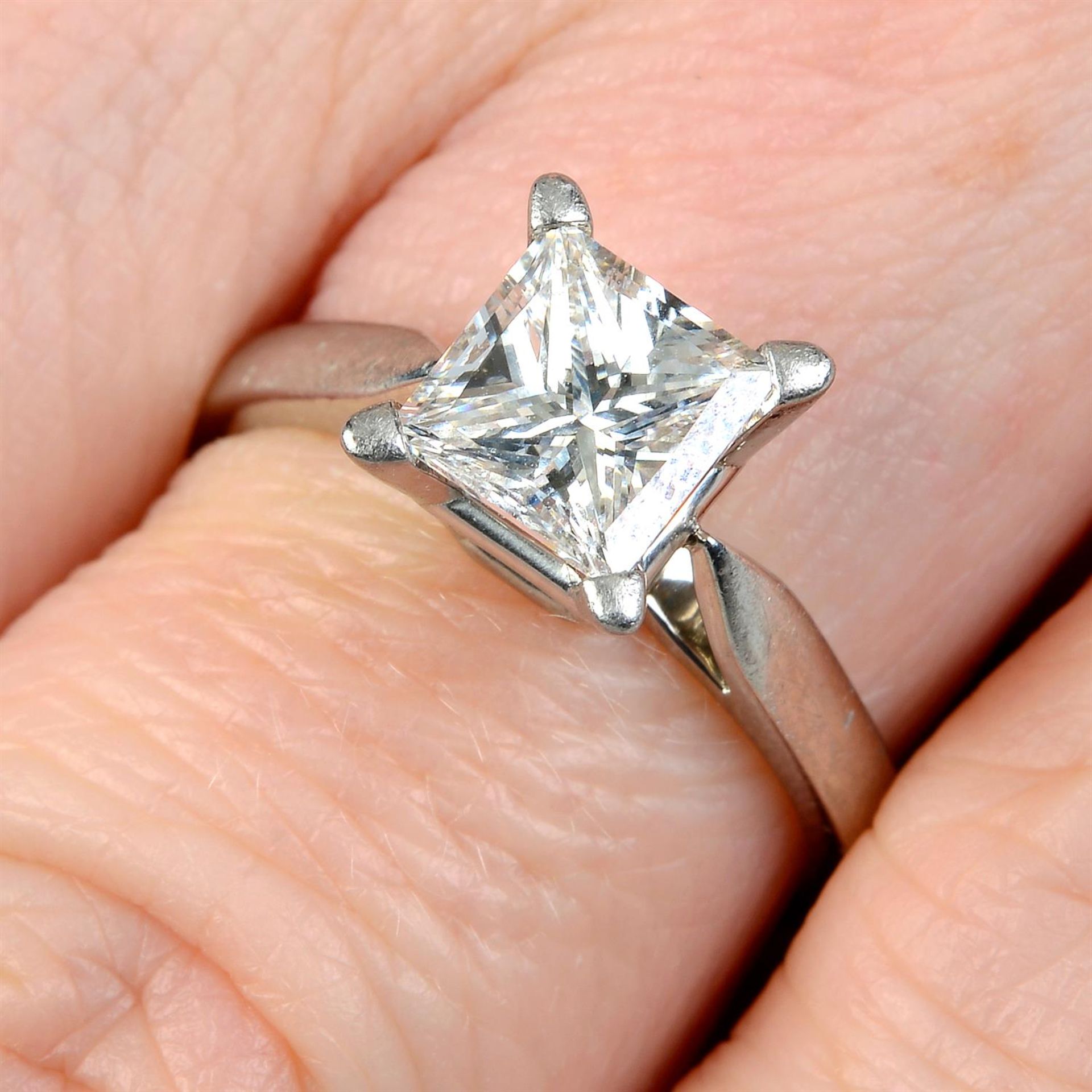 A platinum square-shape diamond single-stone ring.