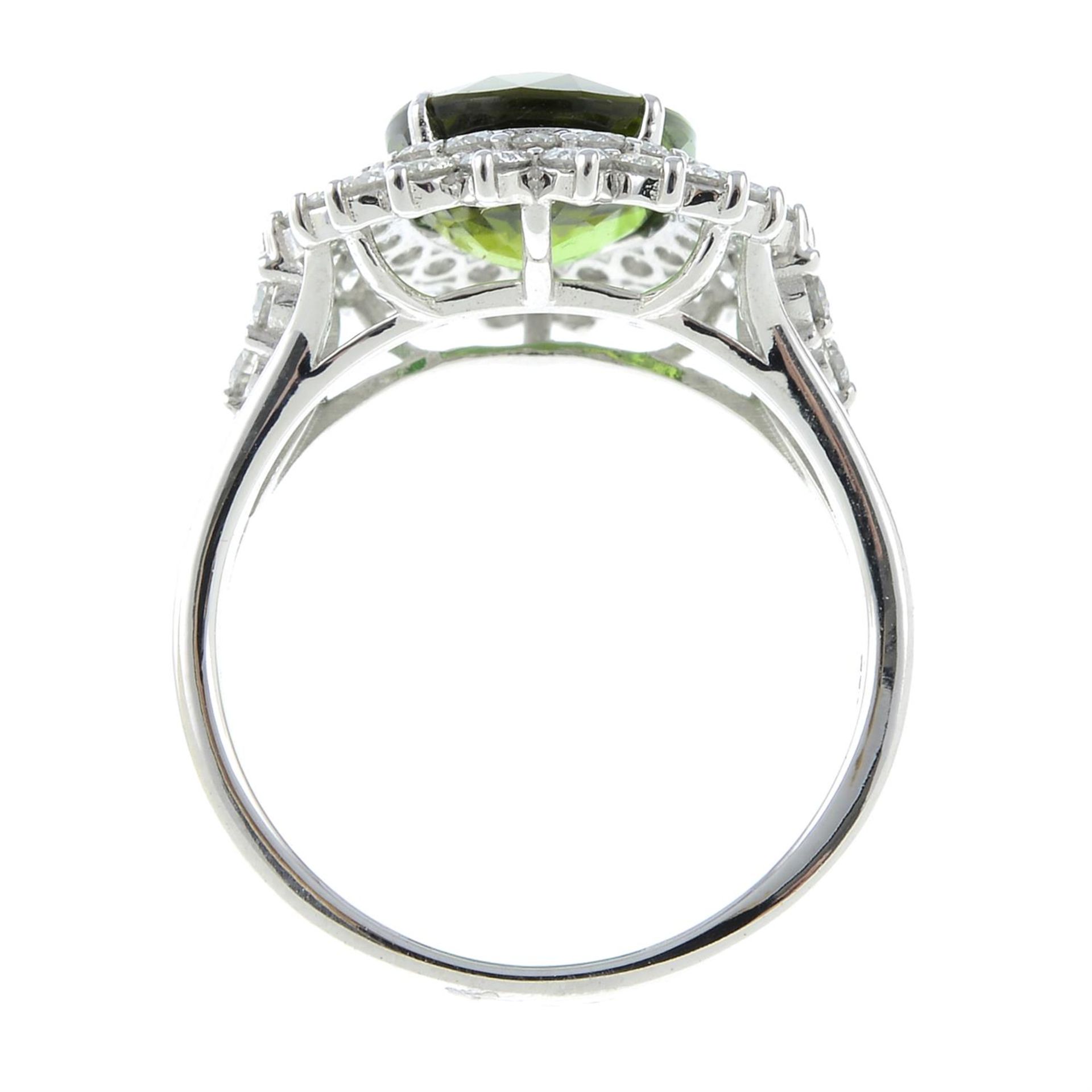 A green tourmaline ring, with brilliant-cut diamond surrounds and shoulders. - Image 5 of 6