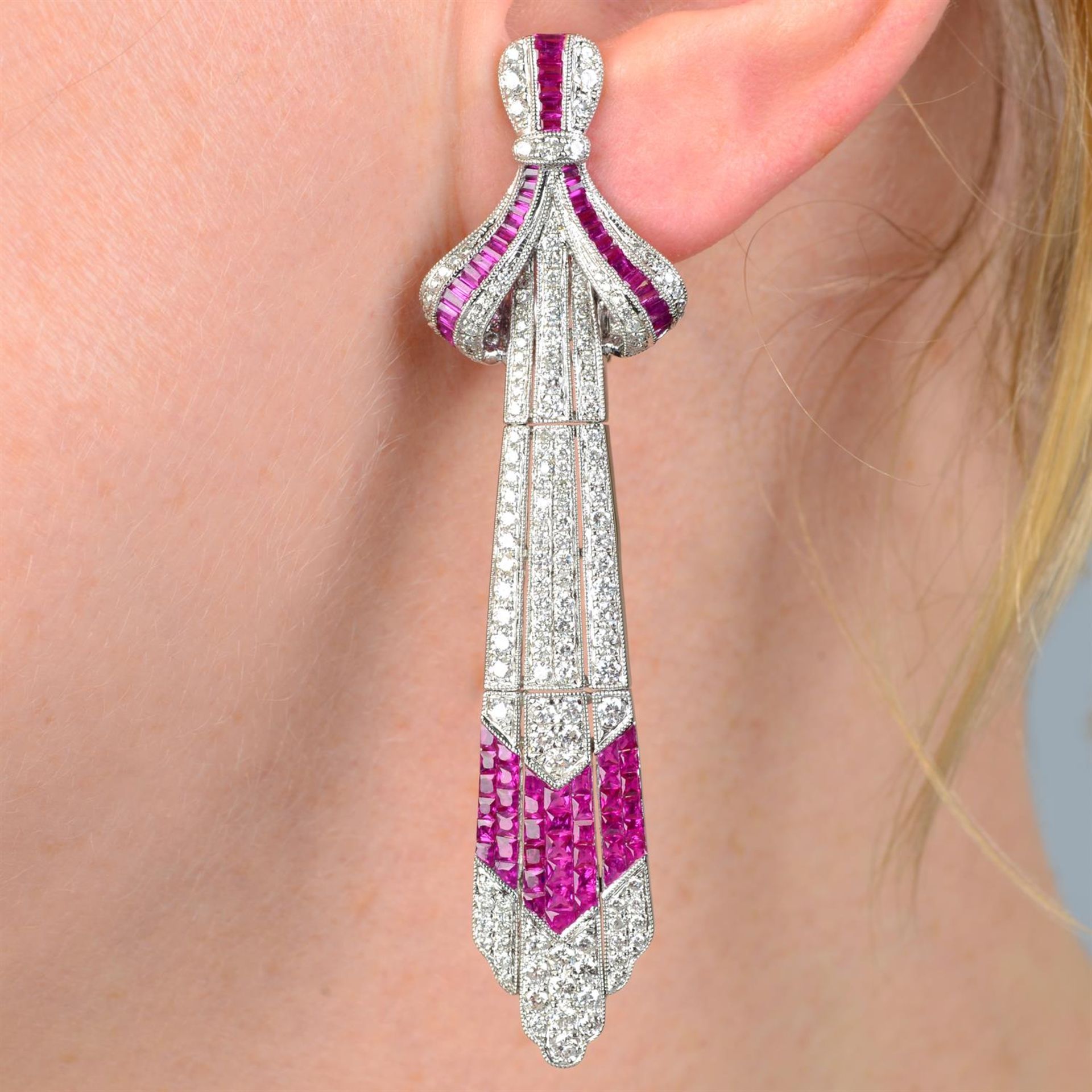 A pair of diamond and ruby earrings.