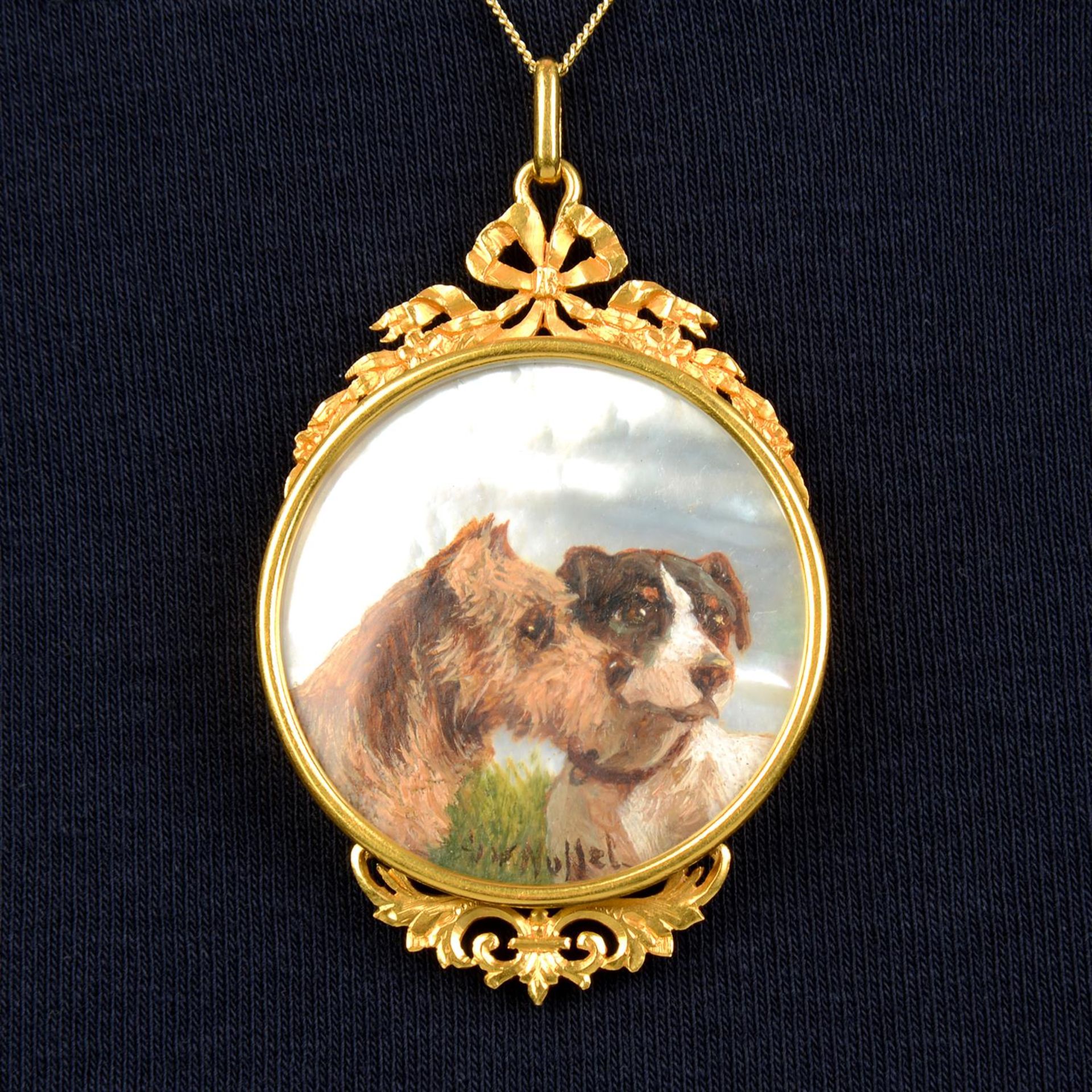 An early 20th century portrait miniature pendant of two dogs on mother-of-pearl, with gold Belle