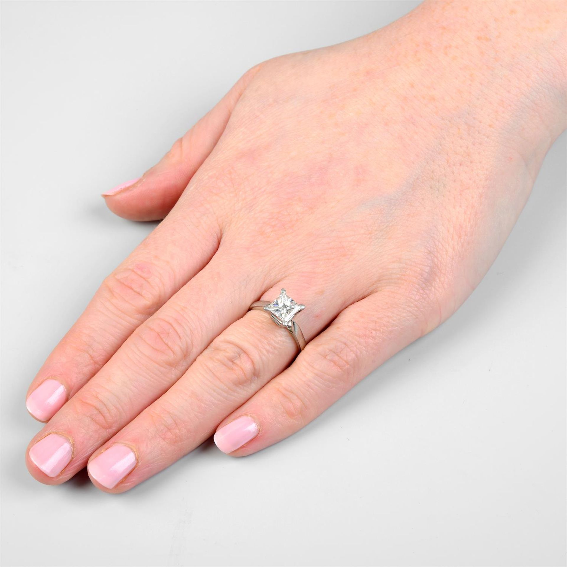 A platinum square-shape diamond single-stone ring. - Image 6 of 7