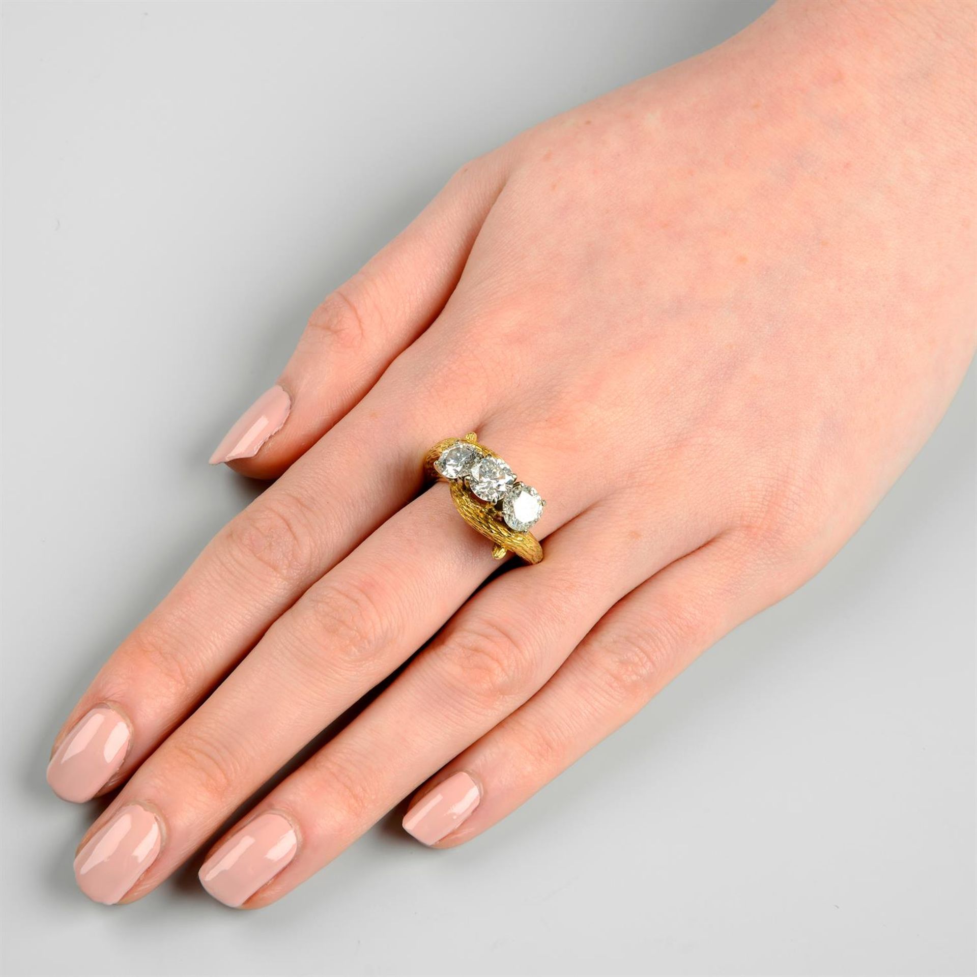 A mid 20th century 18ct gold brilliant-cut diamond and laser-drilled diamond three-stone ring. - Image 6 of 6