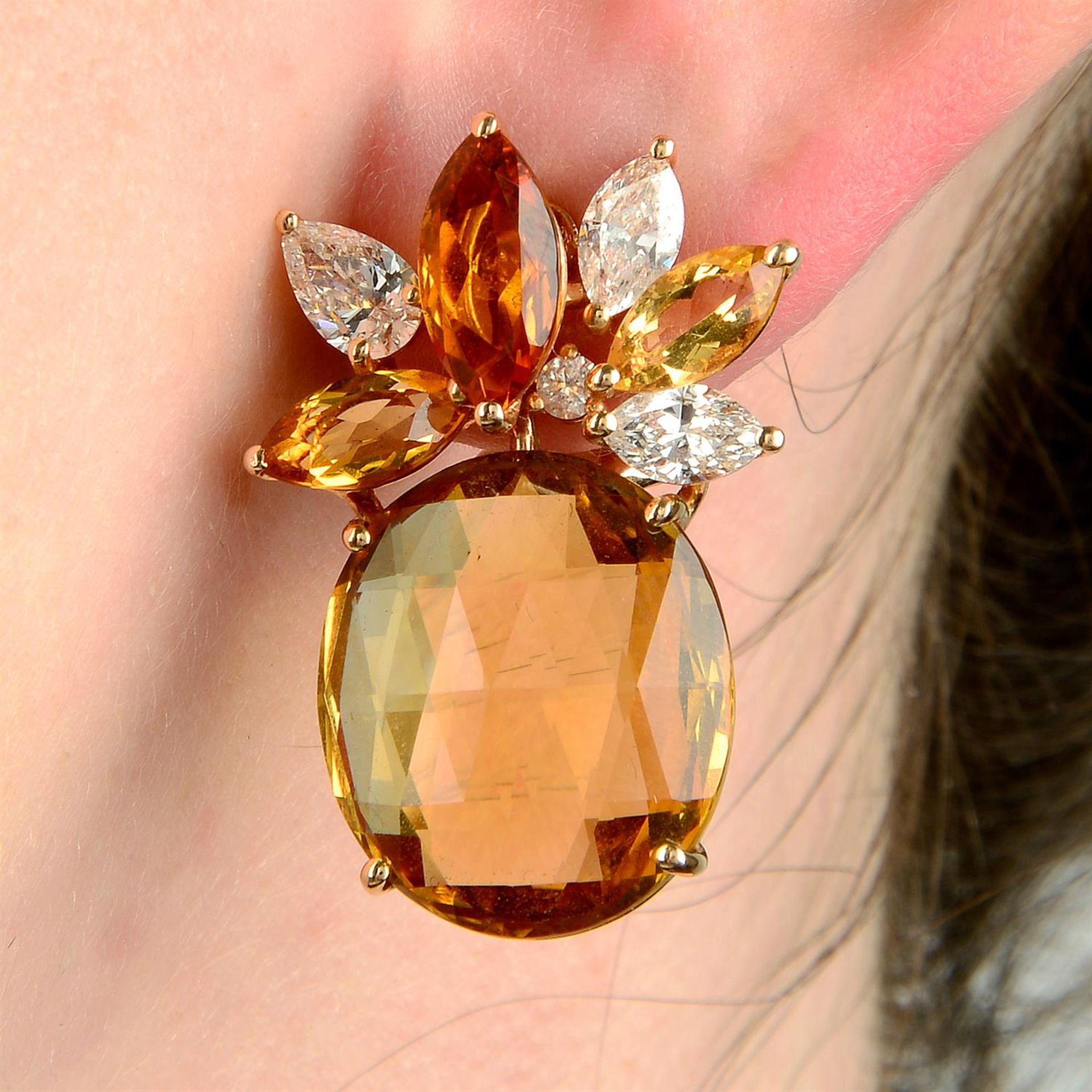 A pair of 18ct gold citrine and diamond earrings.