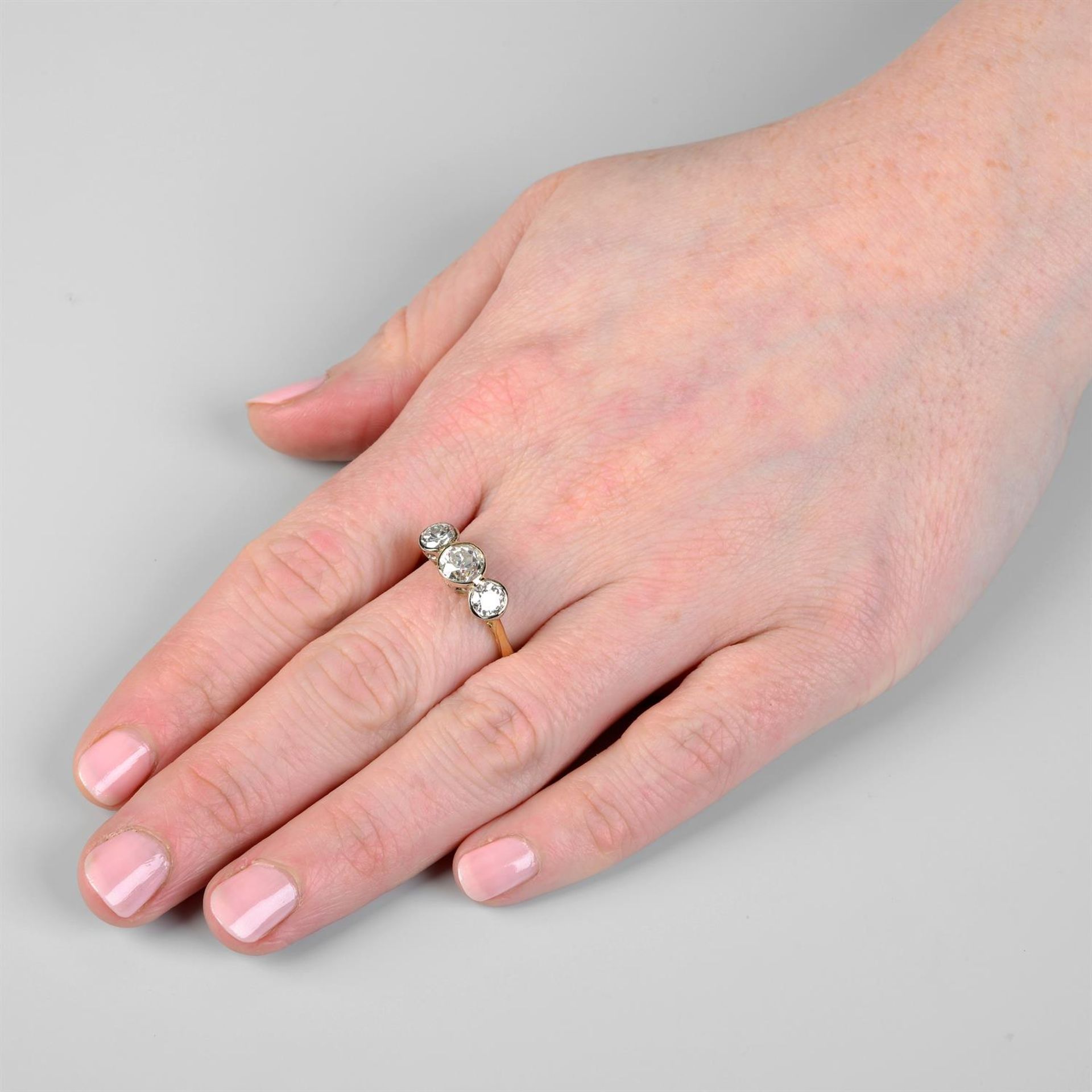 An 18ct gold graduated old-cut diamond three-stone ring. - Image 5 of 5
