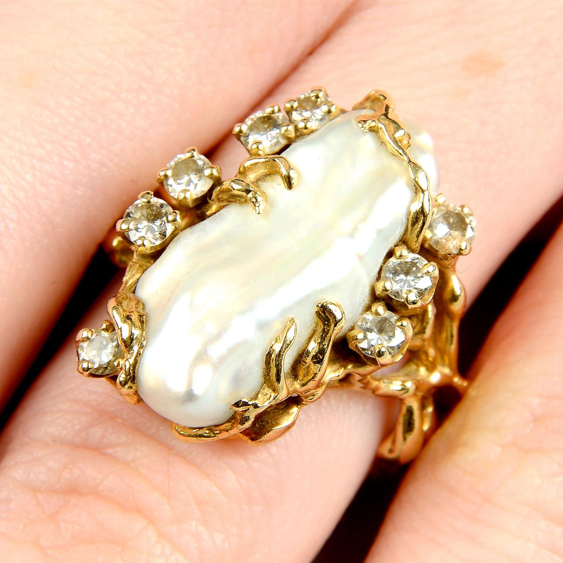 A mid 20th century 14ct gold baroque cultured pearl and brilliant-cut diamond ring.