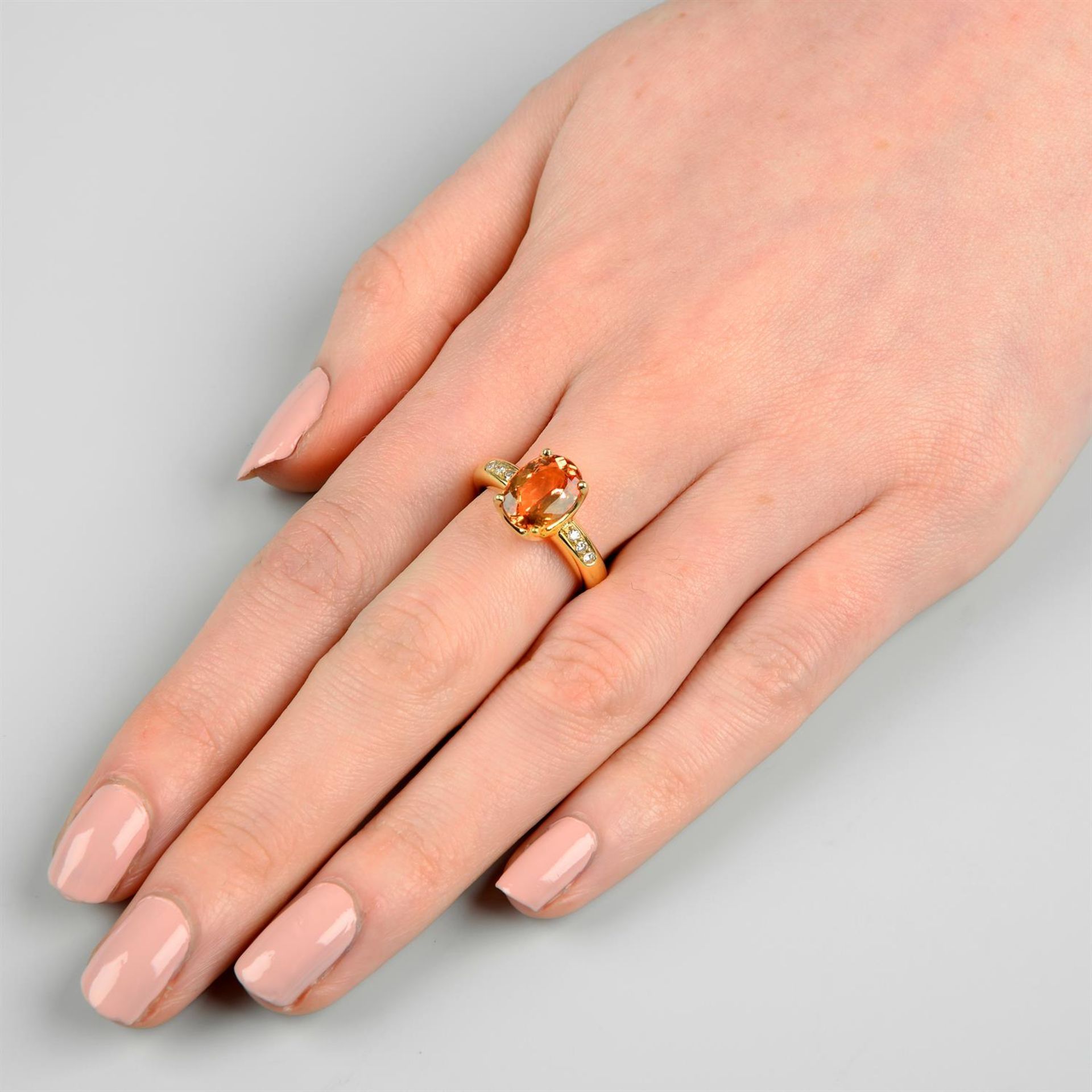 An orange topaz ring, with brilliant-cut diamond line shoulders, by H. Stern. - Image 6 of 6