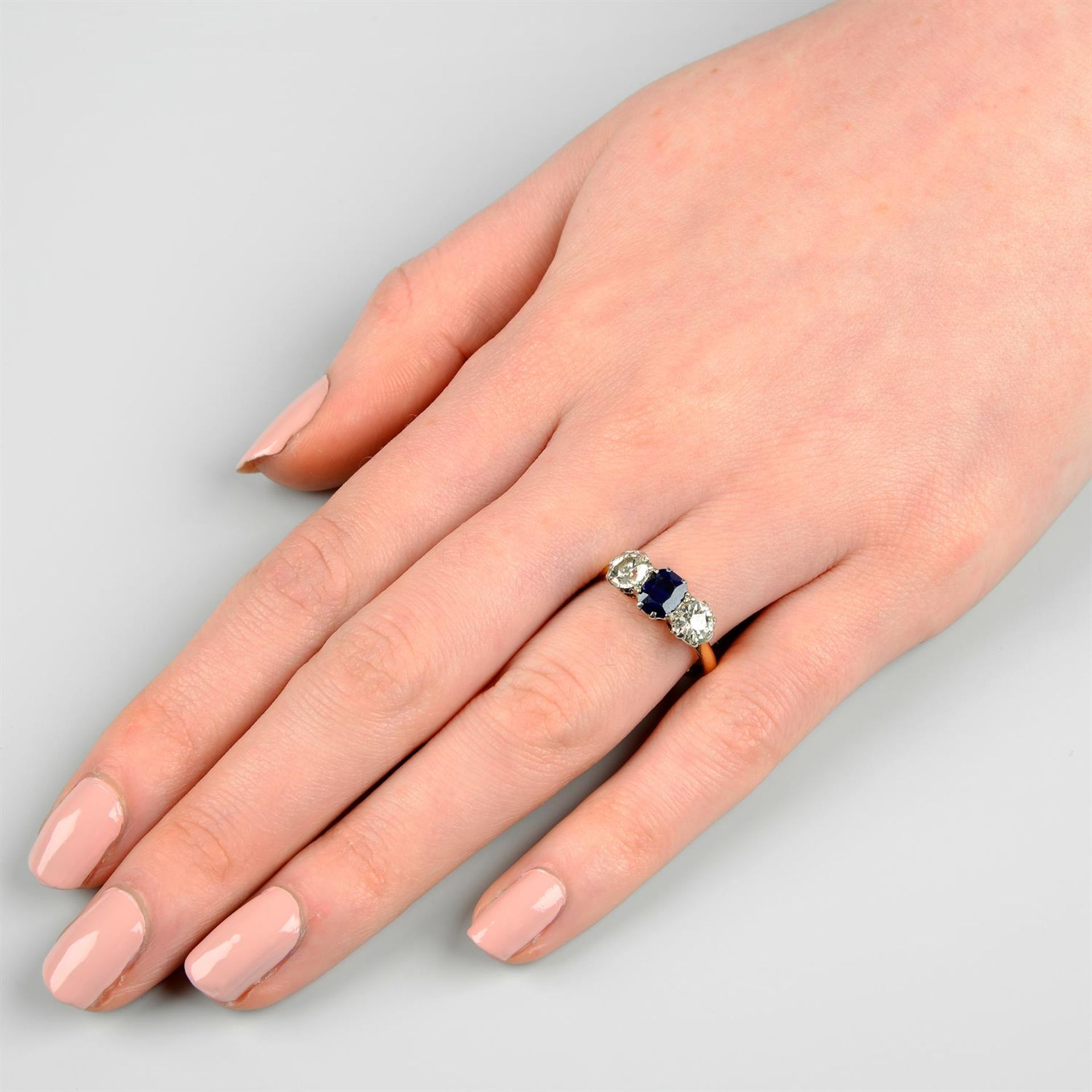 An early 20th century 18ct gold sapphire and old-cut diamond three-stone ring. - Image 6 of 6