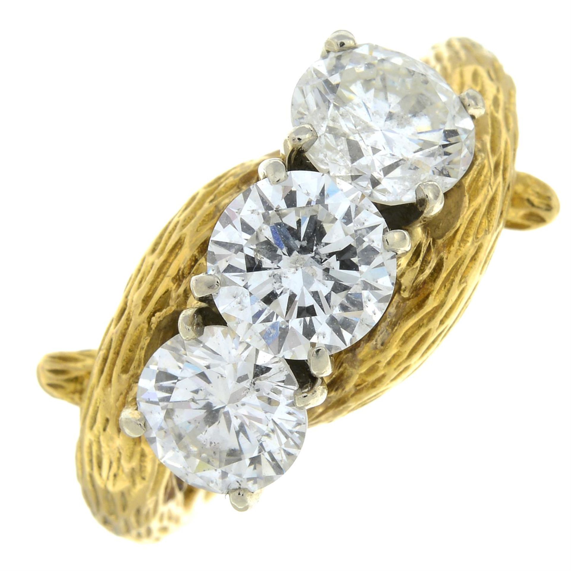 A mid 20th century 18ct gold brilliant-cut diamond and laser-drilled diamond three-stone ring. - Image 2 of 6