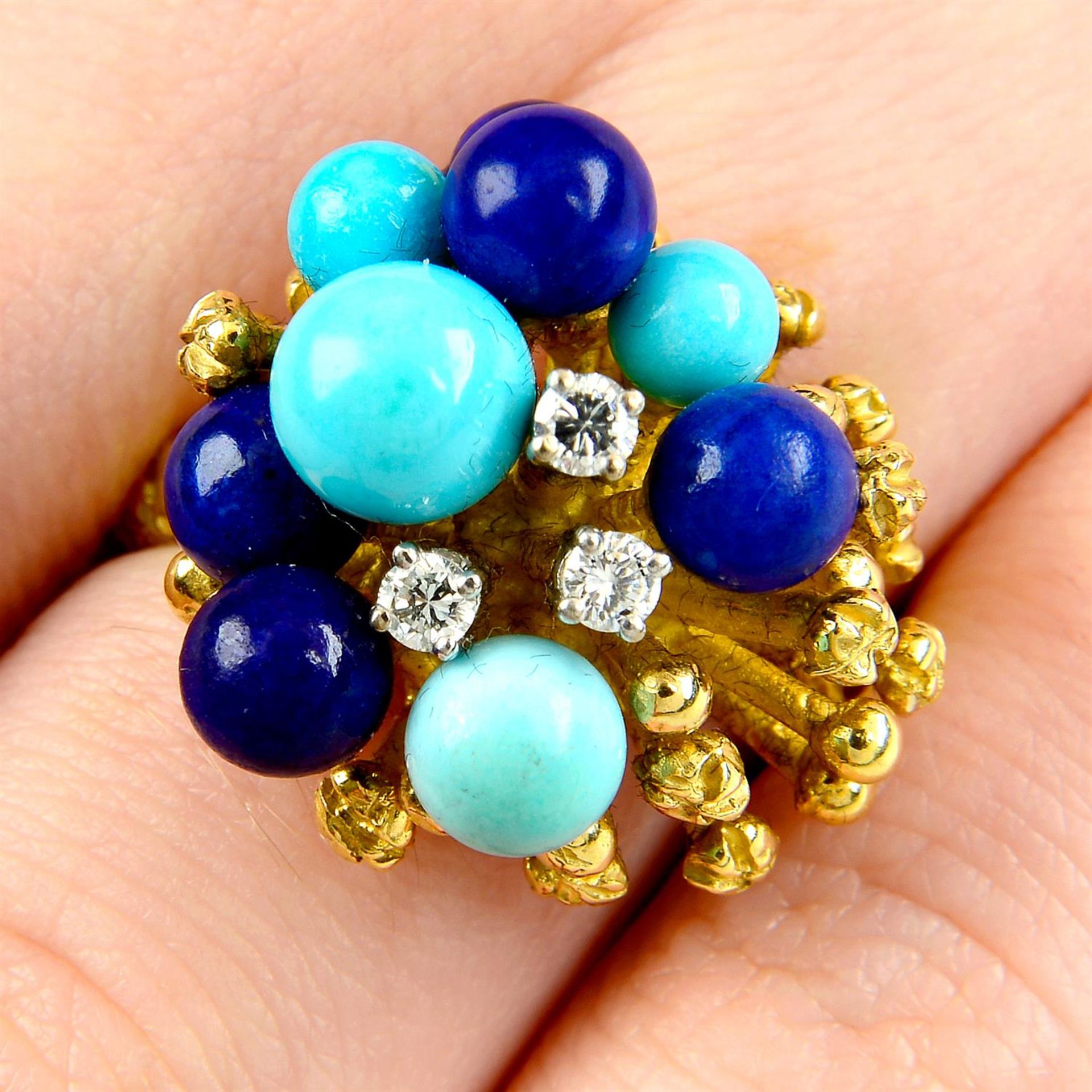 A diamond, turquoise and lapis lazuli bead bombè ring, with textured shoulders.