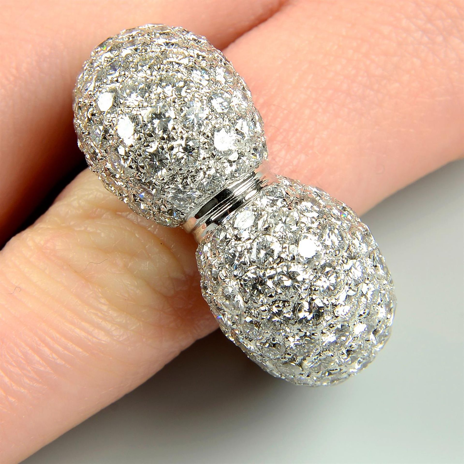 A pavé-set diamond heart ring.