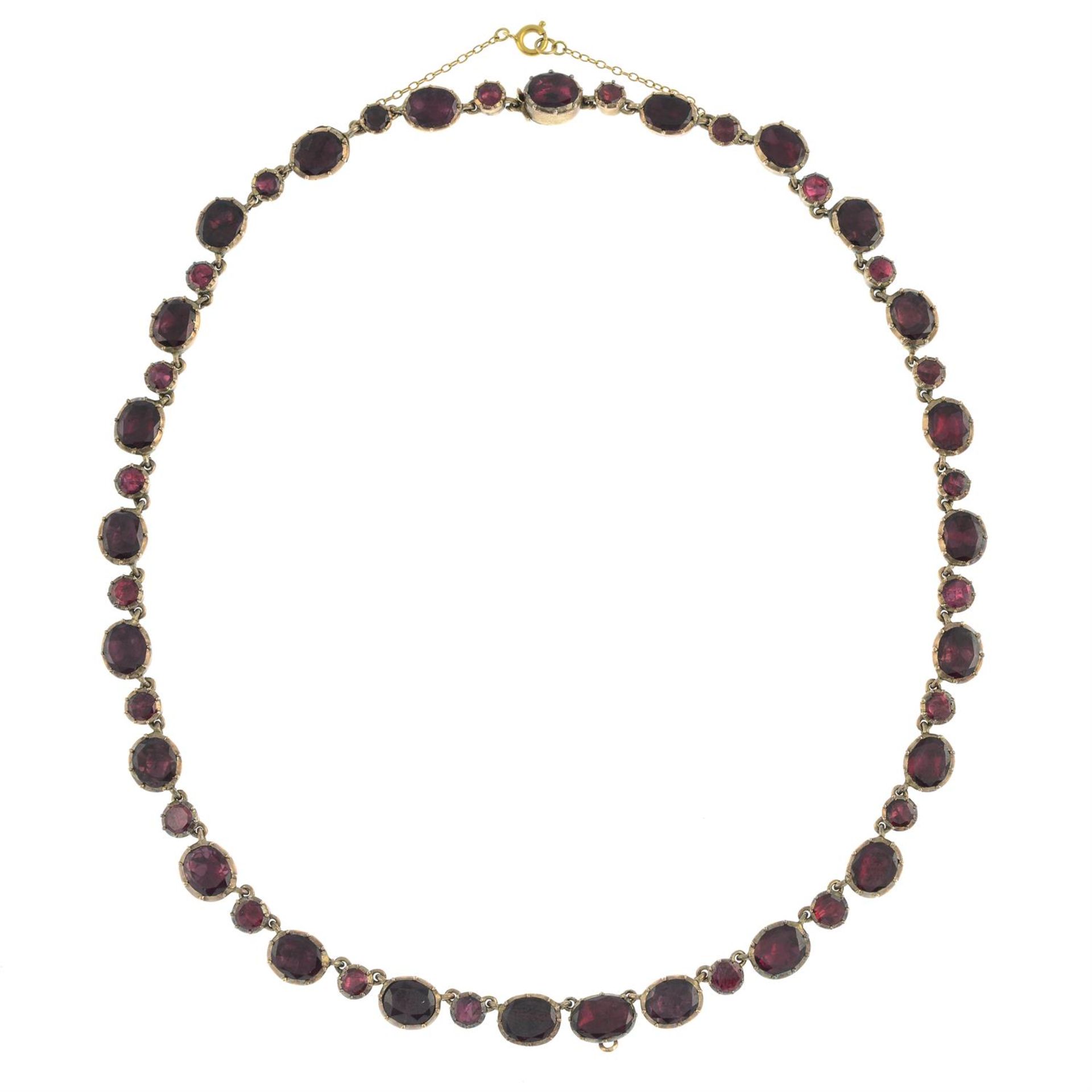 A late Georgian gold foil back garnet rivière necklace. - Image 3 of 5