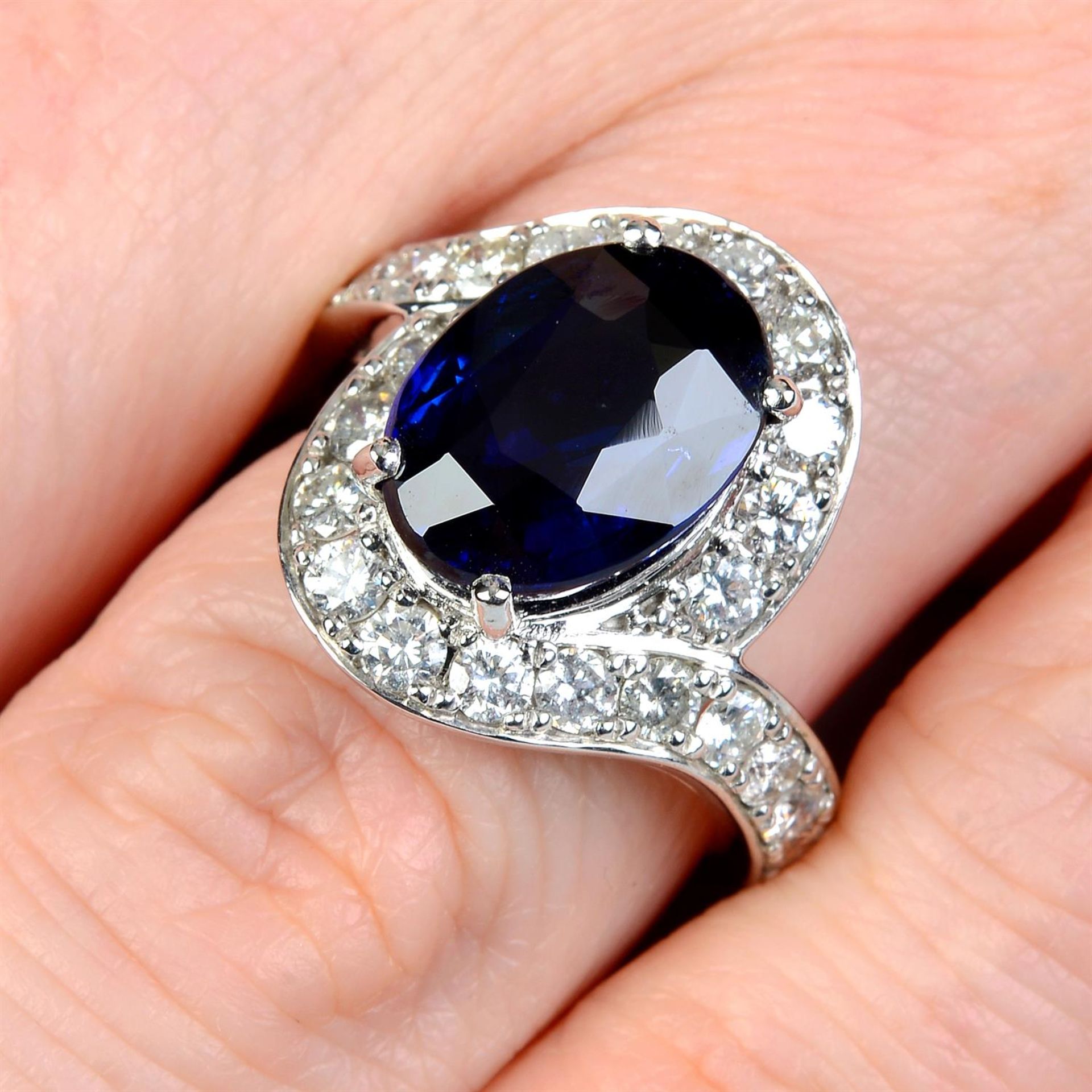 A sapphire and brilliant-cut diamond dress ring.