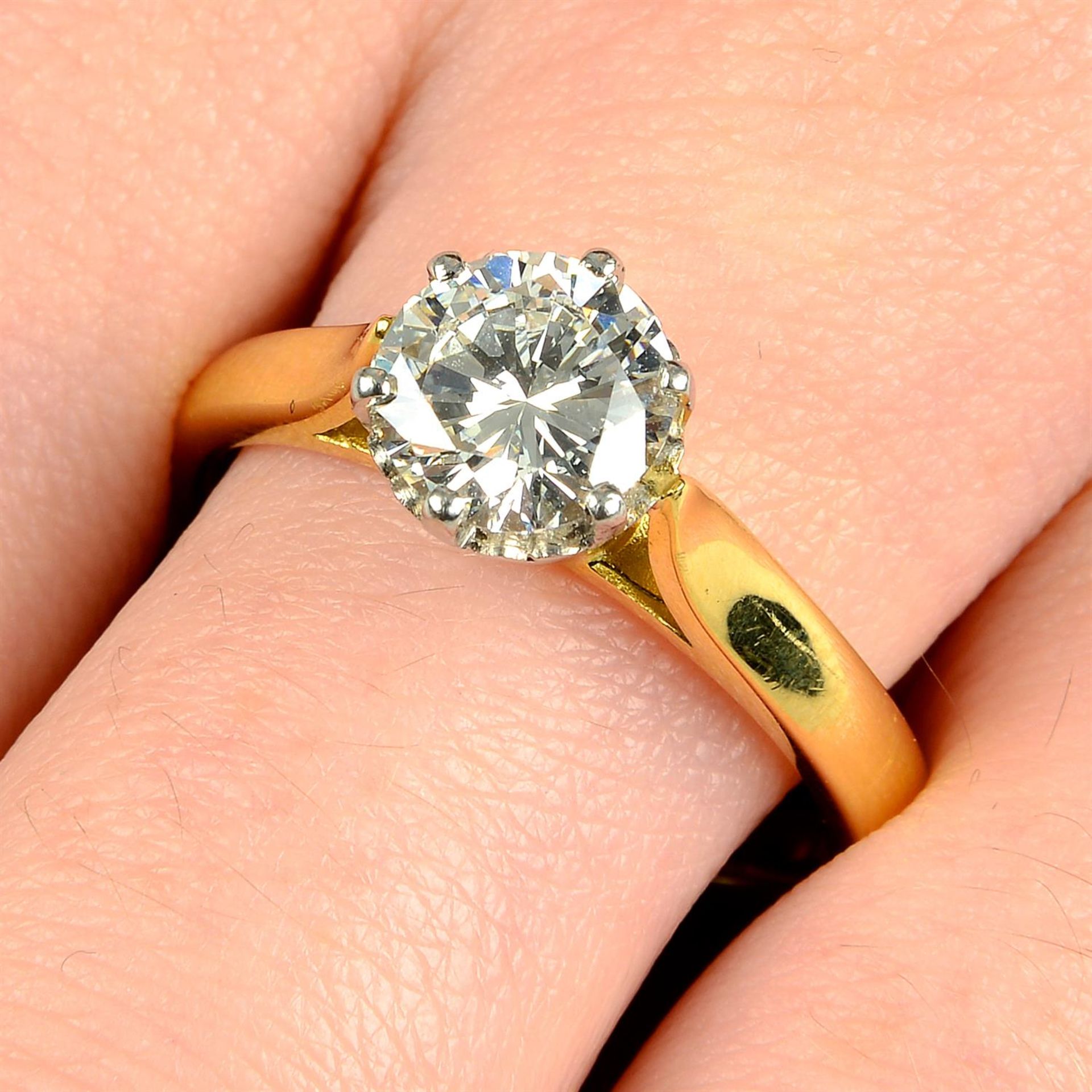 An 18ct gold diamond single-stone ring.