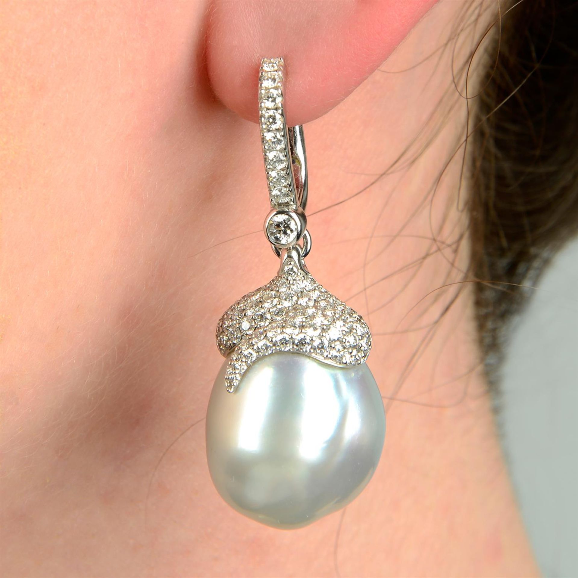 A pair of 18ct gold South Sea baroque cultured pearl and diamond earrings, by Mikimoto.