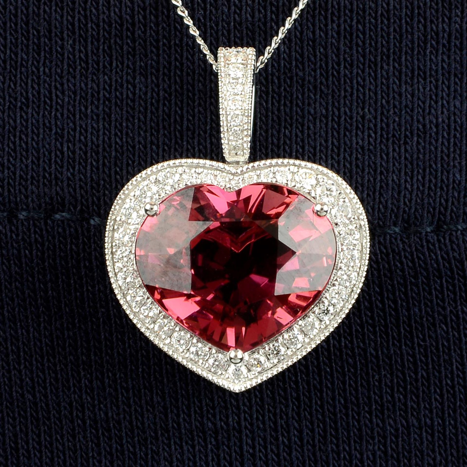 An 18ct gold heart-shape pink tourmaline and diamond pendant, with chain.