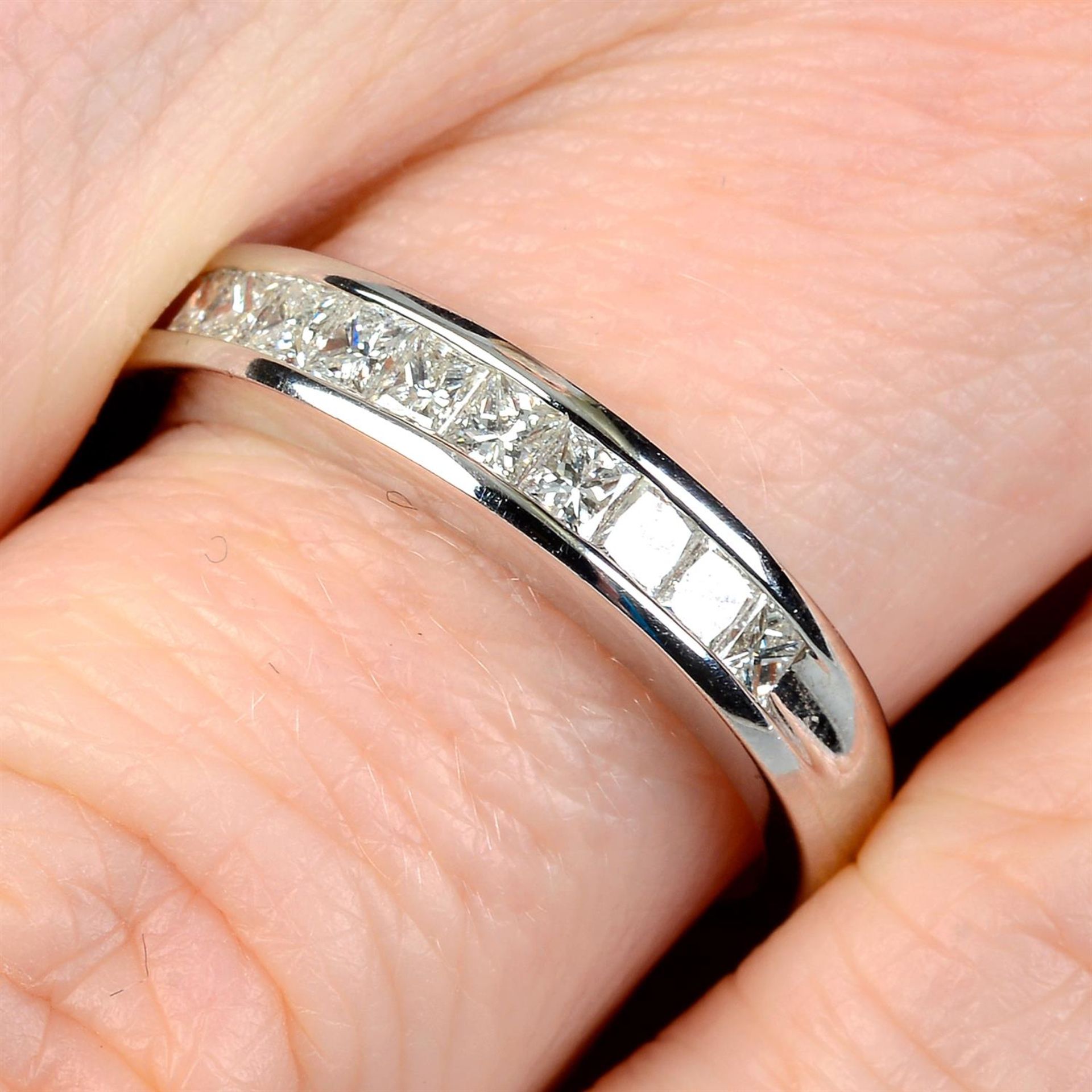 A square-shape diamond half-eternity ring.