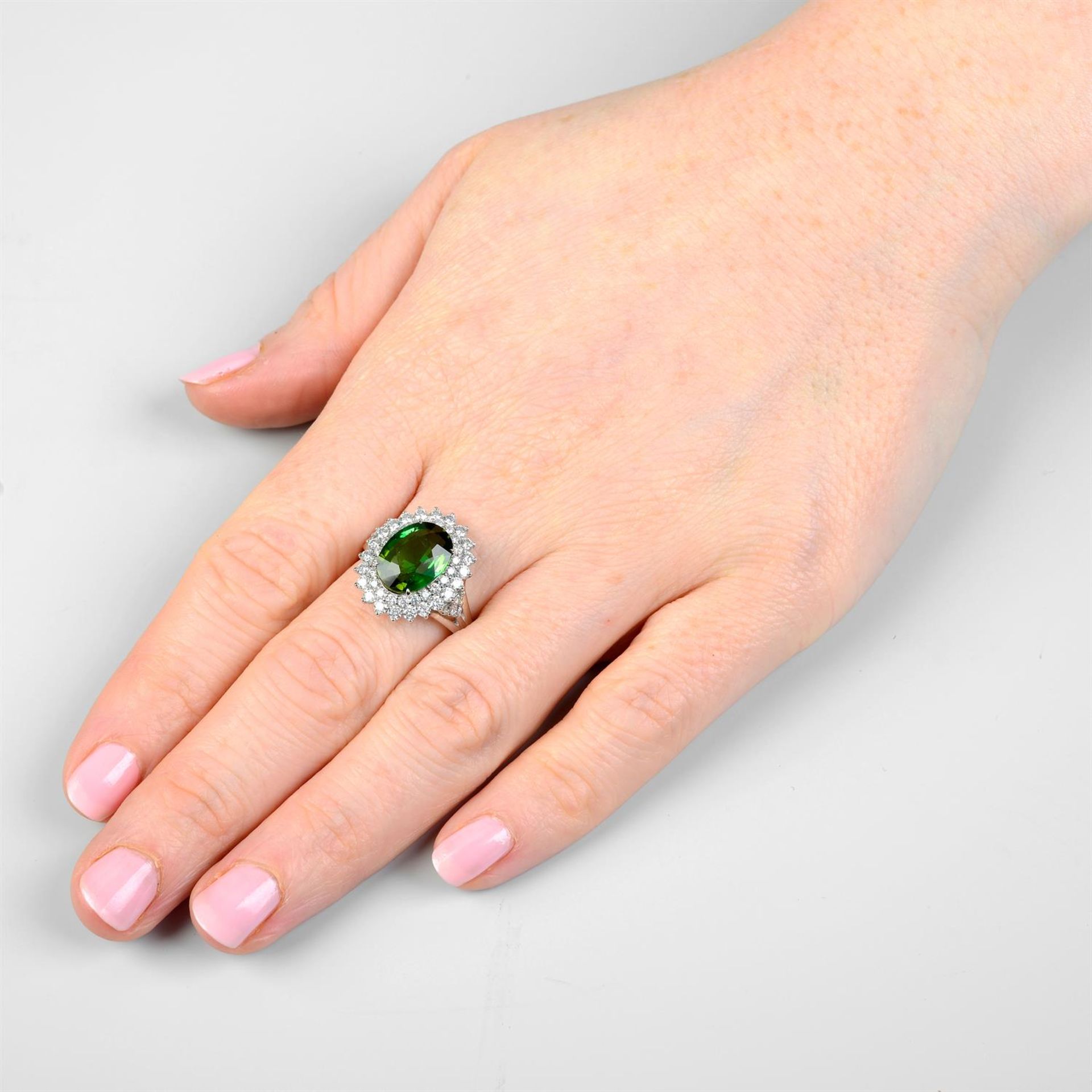 A green tourmaline ring, with brilliant-cut diamond surrounds and shoulders. - Image 6 of 6