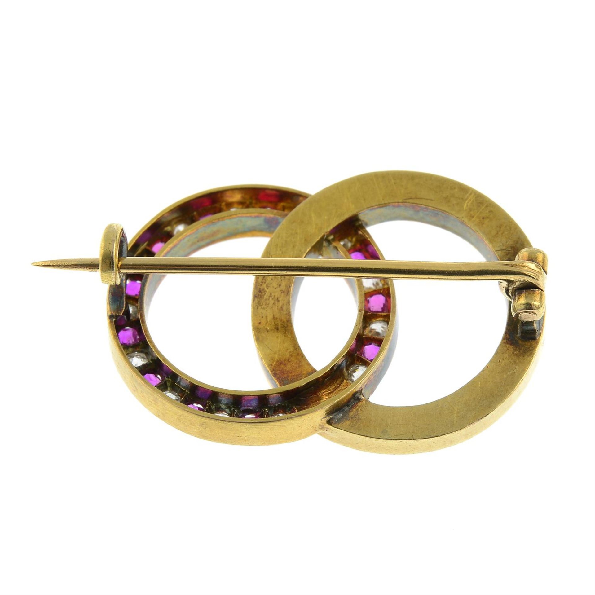 An early 20th century 18ct gold brooch, comprising alternating old-cut diamond, pink sapphire and - Image 3 of 4