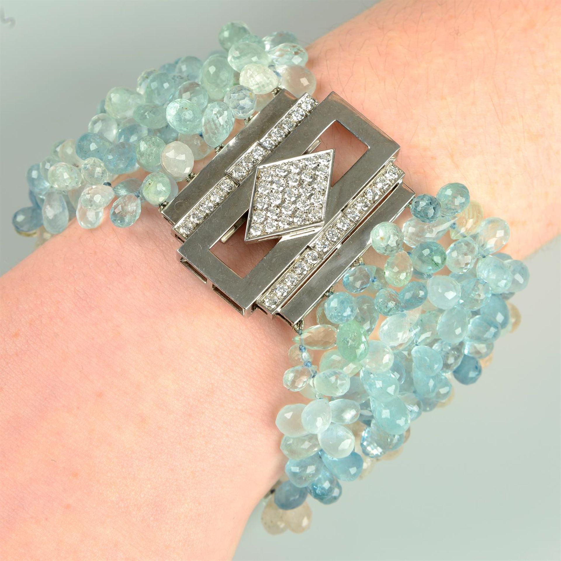 An aquamarine, morganite and heliodor briolette bracelet, with brilliant-cut diamond clasp.