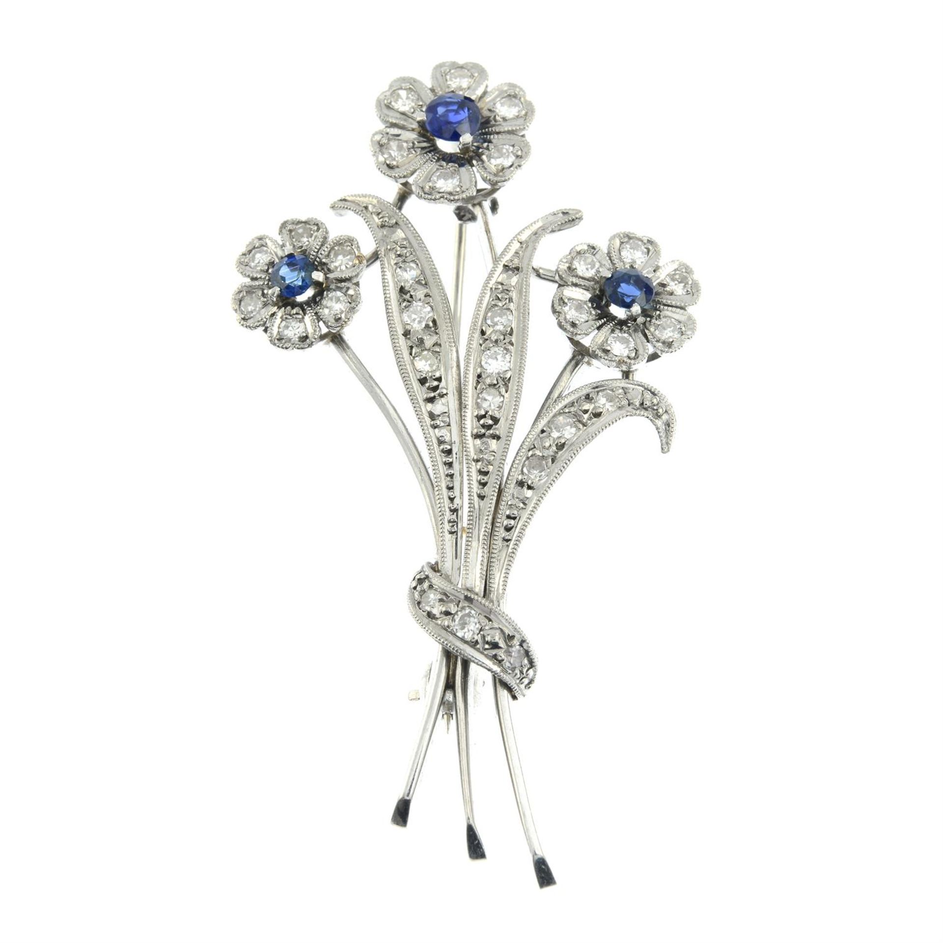 A mid 20th century 18ct gold vari-cut diamond and sapphire floral spray brooch. - Bild 2 aus 4