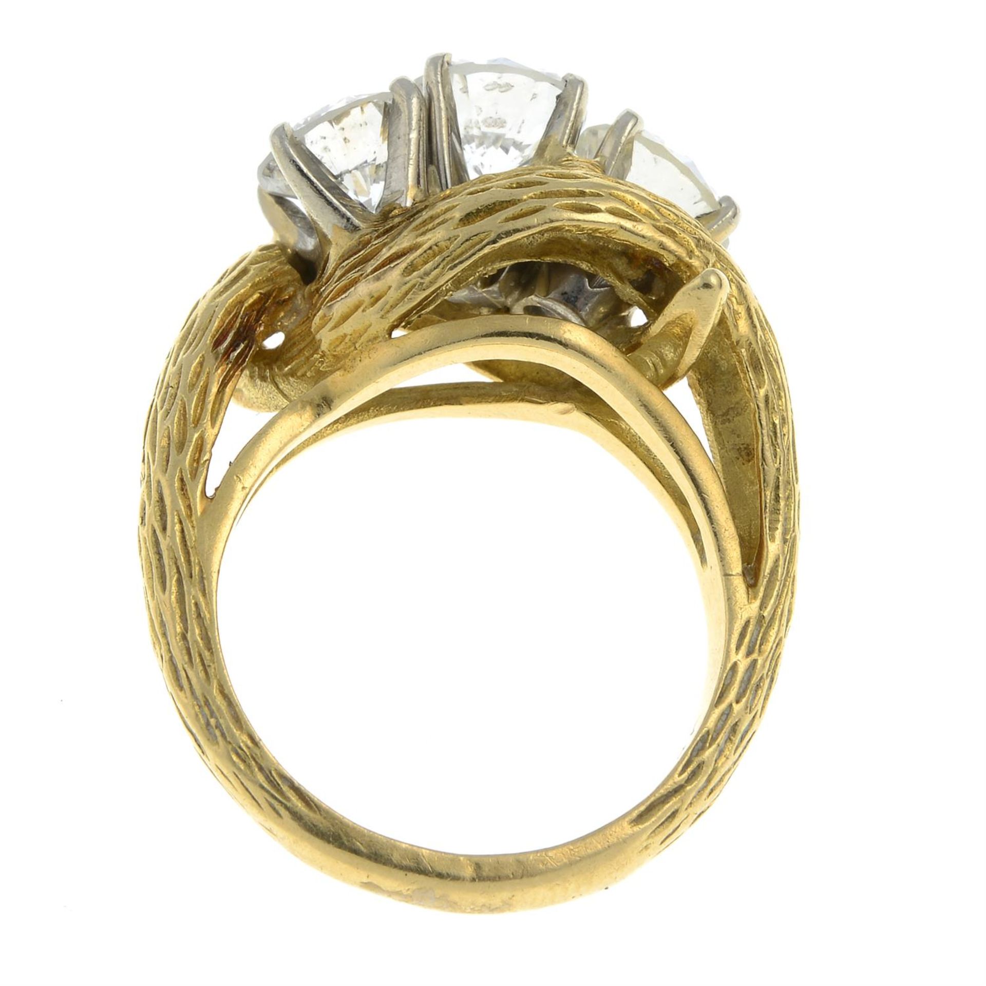 A mid 20th century 18ct gold brilliant-cut diamond and laser-drilled diamond three-stone ring. - Image 5 of 6