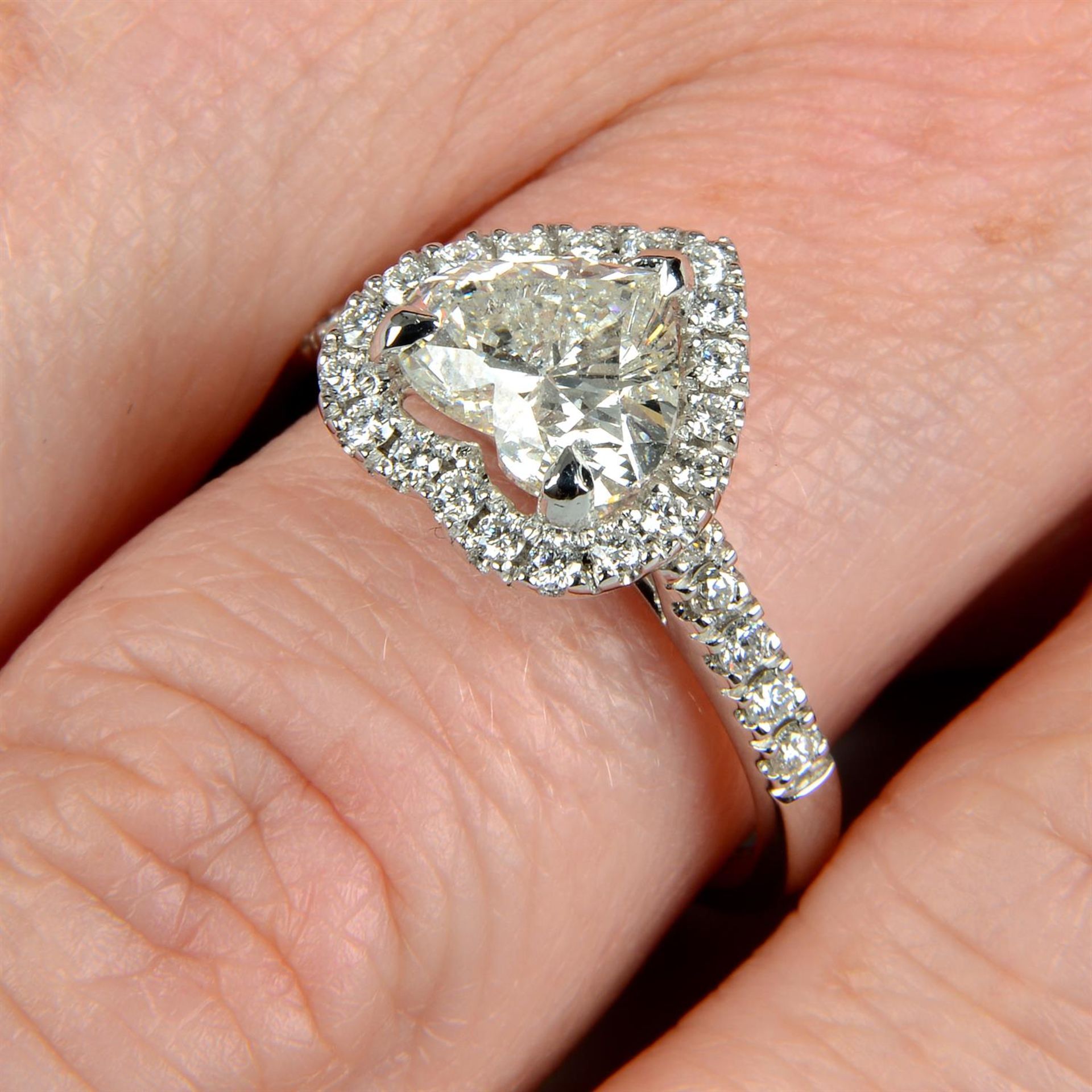 An 18ct gold laser-drilled heart-shape diamond single-stone ring, with brilliant-cut diamond