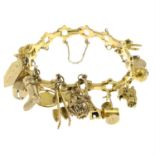 A 9ct gold charm bracelet, suspending fifteen charms , together with two loose charms.