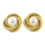 A pair of cultured pearl earrings.