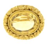 An early 19th century gold citrine brooch, with foliate surround.