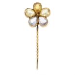 A late 19th century gold amethyst and citrine floral stickpin.