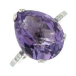 An 18ct gold amethyst dress ring, with amethyst and diamond line shoulders.
