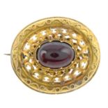 A late Victorian garnet brooch.