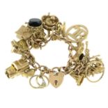 An Edwardian 9ct gold bracelet, suspending later charms.