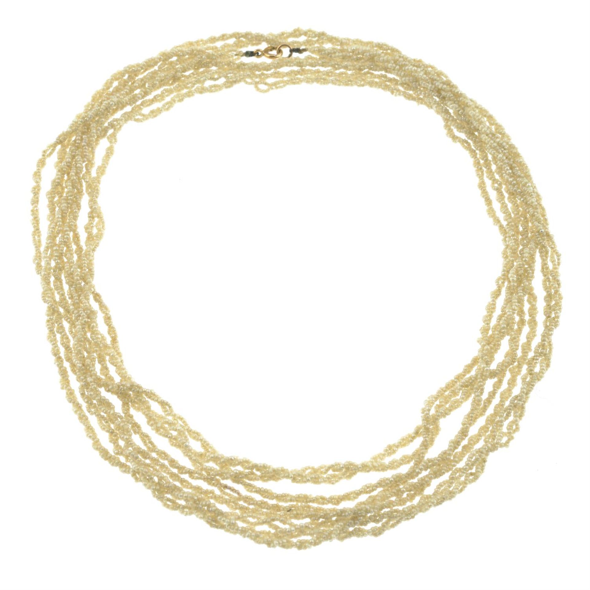 A seed pearl longuard necklace.