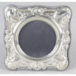 A modern silver mounted photograph frame of square form.