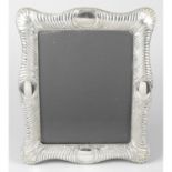 A large silver mounted photograph frame.