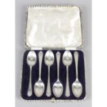 Golfing interest, a cased set of six 1930's silver teaspoons by Walker & Hall.