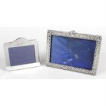 A late Victorian silver mounted photograph frame, together with a modern silver mounted small frame.