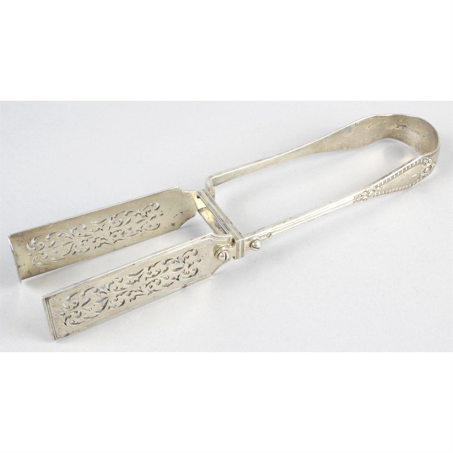 A pair of mid-Victorian silver asparagus tongs.