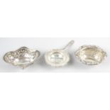 A selection of silver items to include a George V tea strainer, an Edwardian bonbon dish,
