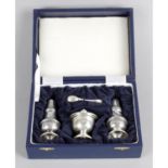 A cased modern silver condiment set.