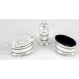 A 20th century silver pierced three piece condiment set.