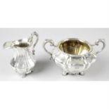 A William IV silver twin-handled sugar bowl and matching cream jug.
